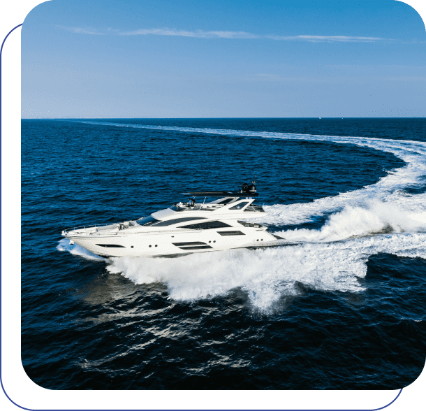 A white motor yacht traveling in the ocean.